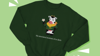 A dark green sweater with an illustration of Dottie the Cow, with text that reads "the associated students of uc davis".