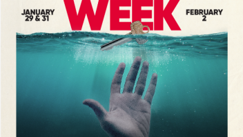 A hand in the ocean reaching for a key during "housing week"