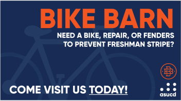 A blue "bike barn" poster with a bike in the background